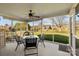 The screened porch offers outdoor dining with a ceiling fan and backyard views at 4405 Zee Ct, Monroe, NC 28110