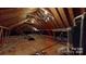 Unfinished attic space, potential for storage or future expansion with visible beams at 4739 Binfords Ridge Rd, Charlotte, NC 28226