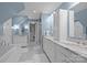 Bright bathroom with marble countertops, tile floors, soaking tub, and walk-in shower at 4739 Binfords Ridge Rd, Charlotte, NC 28226