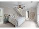 Cozy bedroom with a unique hanging chair, plush bedding, and neutral tones at 4739 Binfords Ridge Rd, Charlotte, NC 28226