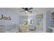 Bedroom with a crib, windows with roman shades, and blue walls at 4739 Binfords Ridge Rd, Charlotte, NC 28226
