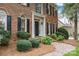 Beautiful brick home featuring a covered front entry and manicured landscaping at 4739 Binfords Ridge Rd, Charlotte, NC 28226