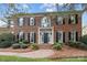 Elegant brick home featuring a stately entrance with black shutters and brick walkway at 4739 Binfords Ridge Rd, Charlotte, NC 28226