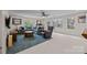 Spacious living room with large windows, comfortable seating, and natural light at 4739 Binfords Ridge Rd, Charlotte, NC 28226