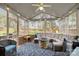 Inviting screened-in porch with comfortable seating and an outdoor fireplace at 4739 Binfords Ridge Rd, Charlotte, NC 28226