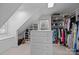 Large walk-in closet with multiple racks and shelves and bright overhead lighting at 4739 Binfords Ridge Rd, Charlotte, NC 28226
