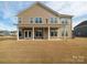 Expansive backyard with covered patio, perfect for outdoor entertaining and relaxation at 611 Yucatan Dr, Waxhaw, NC 28173
