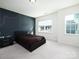 A bedroom offering large windows with natural light and a statement accent wall at 611 Yucatan Dr, Waxhaw, NC 28173