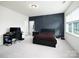 Spacious bedroom featuring a statement accent wall and ample natural light at 611 Yucatan Dr, Waxhaw, NC 28173