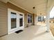 Inviting covered patio featuring ample space, neutral colors, and a welcoming 'hello' doormat at 611 Yucatan Dr, Waxhaw, NC 28173