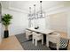 Bright dining room showcases modern lighting, stylish seating, and views of other parts of the home at 611 Yucatan Dr, Waxhaw, NC 28173