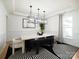 Modern dining room featuring stylish lighting, unique seating arrangements, and a contemporary black-and-white rug at 611 Yucatan Dr, Waxhaw, NC 28173