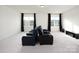Spacious theater room with tiered seating and large windows providing natural light at 611 Yucatan Dr, Waxhaw, NC 28173