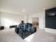 Finished basement with media seating and a basketball hoop for entertainment at 611 Yucatan Dr, Waxhaw, NC 28173