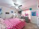 Charming bedroom with a ceiling fan, desk, and plush decor creating a delightful and personalized space at 1004 Loganberry Ln, Salisbury, NC 28146