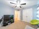 Well-lit bedroom features a large TV and closet creating functional living space at 1004 Loganberry Ln, Salisbury, NC 28146