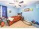Blue bedroom features a single bed, dark wood furniture, and fun decor at 1004 Loganberry Ln, Salisbury, NC 28146
