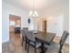 Cozy dining room with a modern light fixture and view into the kitchen at 1004 Loganberry Ln, Salisbury, NC 28146