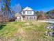 Beautiful two-story brick home with a manicured lawn on a sunny day at 1004 Loganberry Ln, Salisbury, NC 28146