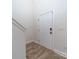 Entryway featuring a white front door and wood-look vinyl flooring at 1004 Loganberry Ln, Salisbury, NC 28146
