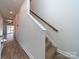 Hallway view with carpeted stairs and wood-look flooring at 1004 Loganberry Ln, Salisbury, NC 28146