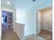 Bright hallway with carpeted stairs and access to rooms, offering a clear path through the home at 1004 Loganberry Ln, Salisbury, NC 28146