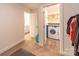 Easy access to the laundry room from this bedroom with a view to a washer and dryer at 1004 Loganberry Ln, Salisbury, NC 28146