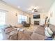 Comfortable living room showcasing a fireplace, large windows, and plenty of seating at 1004 Loganberry Ln, Salisbury, NC 28146