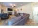 Inviting living room featuring a fireplace, large sectional sofa, and neutral decor at 1004 Loganberry Ln, Salisbury, NC 28146
