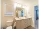 The main bathroom has double sinks, neutral cabinets and lighting, and a large mirror at 1004 Loganberry Ln, Salisbury, NC 28146