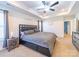 The main bedroom has a ceiling fan, neutral carpet, and two windows for natural light at 1004 Loganberry Ln, Salisbury, NC 28146