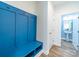 Mudroom featuring a built-in bench with storage and convenient access to an adjacent powder room at 1004 Loganberry Ln, Salisbury, NC 28146