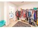 Ample storage space in this walk-in closet with hanging racks and a central ottoman at 1004 Loganberry Ln, Salisbury, NC 28146