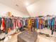 Spacious walk-in closet with ample storage and an ottoman at 1004 Loganberry Ln, Salisbury, NC 28146