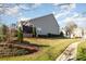 Beautiful house exterior with well-maintained lawn and landscaping, creating a welcoming curb appeal at 10142 Linksland Dr, Huntersville, NC 28078
