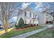 Beautiful two-story home with well-maintained landscaping and a neatly kept lawn in a quiet neighborhood at 10142 Linksland Dr, Huntersville, NC 28078
