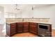 Lovely kitchen featuring granite countertops, wooden cabinets, tile backsplash, and stainless steel appliances at 10142 Linksland Dr, Huntersville, NC 28078