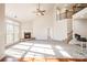 Bright living room with high ceilings, a ceiling fan, fireplace, and lots of natural light at 10142 Linksland Dr, Huntersville, NC 28078