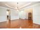 Spacious living room with beautiful hardwood floors, and classic wainscoting at 10142 Linksland Dr, Huntersville, NC 28078