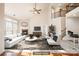 Bright living room with high ceilings, a ceiling fan, fireplace, and lots of natural light at 10142 Linksland Dr, Huntersville, NC 28078