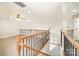 Spacious loft with natural light, staircase with wood and wrought iron railing at 10142 Linksland Dr, Huntersville, NC 28078