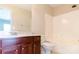 Bright bathroom with a single sink vanity and a shower-tub combination at 10546 Tintinhull Dr, Indian Land, SC 29707