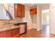 Kitchen with modern stainless-steel dishwasher, granite counter tops and wood floors at 10546 Tintinhull Dr, Indian Land, SC 29707