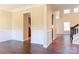 Inviting living room featuring hardwood floors, wainscoting, and abundant natural light at 10546 Tintinhull Dr, Indian Land, SC 29707