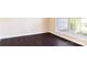 Bright room with hardwood floors and a large window overlooking the outdoors at 10546 Tintinhull Dr, Indian Land, SC 29707