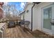 View of the back deck with outdoor seating, with access to the house's door and a beautiful landscape view at 1275 Rocky Ridge Trl, Salisbury, NC 28146