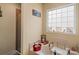 Bathroom featuring a tub with shower, window, and decor at 1275 Rocky Ridge Trl, Salisbury, NC 28146