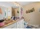 Bathroom featuring double sinks, large mirror and butterflies wall art at 1275 Rocky Ridge Trl, Salisbury, NC 28146