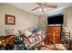 Bedroom with ceiling fan is cluttered with many personal items at 1275 Rocky Ridge Trl, Salisbury, NC 28146