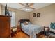 Cozy bedroom with hardwood floors, ceiling fan and decor at 1275 Rocky Ridge Trl, Salisbury, NC 28146